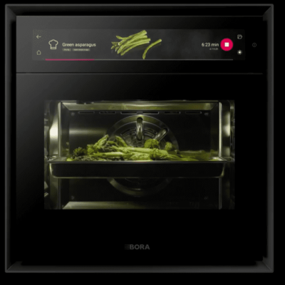 Picture of the Bora XBO, steam oven, cooking & baking systems in use. Now available in the UAE